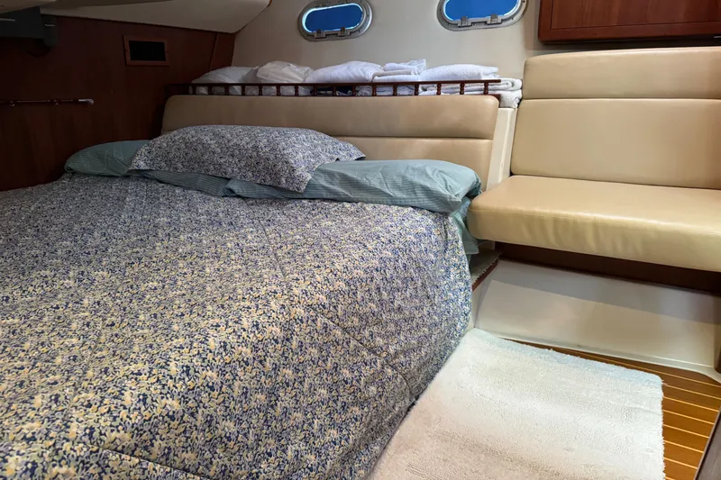 Orion Yacht Photos Pics Cozy cabin interior of 2002 Hunter 410 sailboat with bed and seating area.