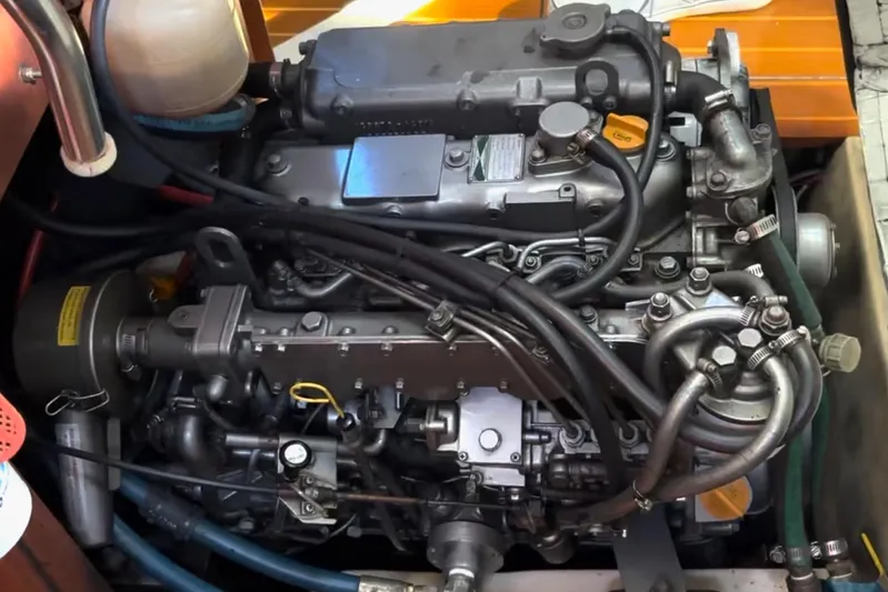 Orion Yacht Photos Pics Engine of a 2002 Hunter 410 boat, showcasing intricate mechanical components and hoses.