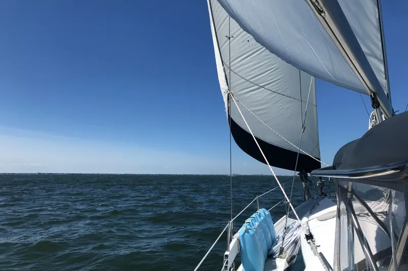 Orion Yacht Photos Pics Sailing on a 2002 Hunter 410 yacht under clear blue skies.