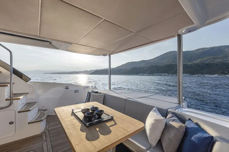 Absolute 50 Fly Yacht Photos Pics Luxurious 2025 Absolute 50 Fly yacht interior with ocean view and elegant seating area.