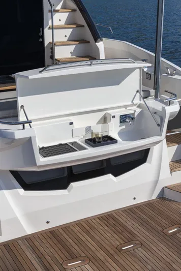 Absolute 50 Fly Yacht Photos Pics 2025 Absolute 50 Fly yacht with open deck storage and sink, featuring sleek design.