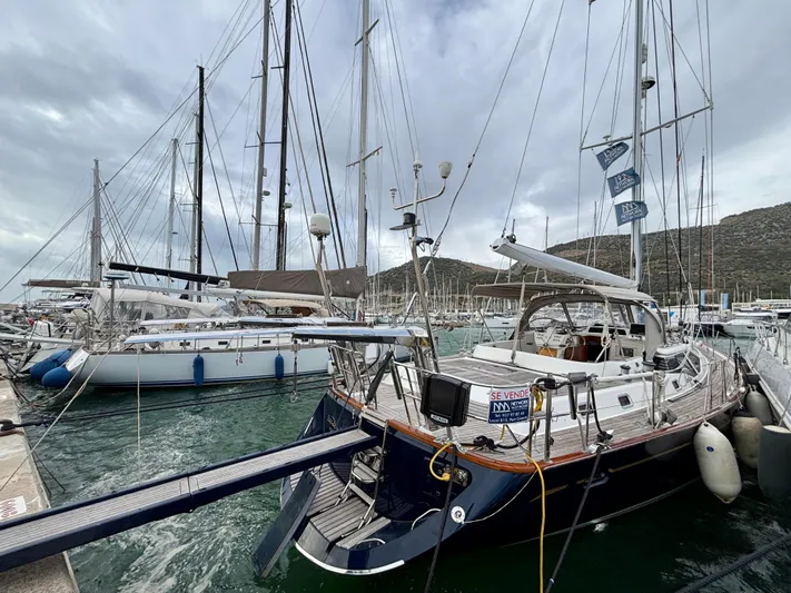  Yacht Photos Pics Sailboats docked at marina, featuring a 2003 Oyster 56 yacht.