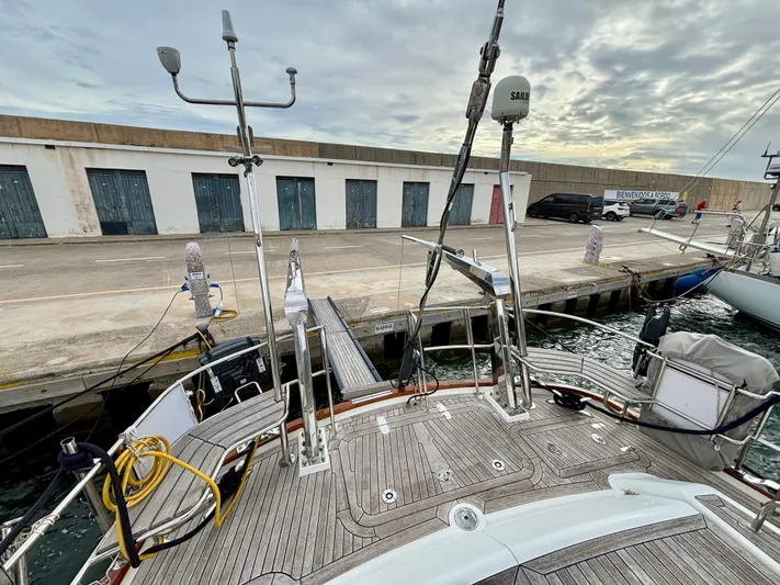  Yacht Photos Pics Sailing yacht Oyster 56 (2003) docked at a marina with wooden deck and equipment.