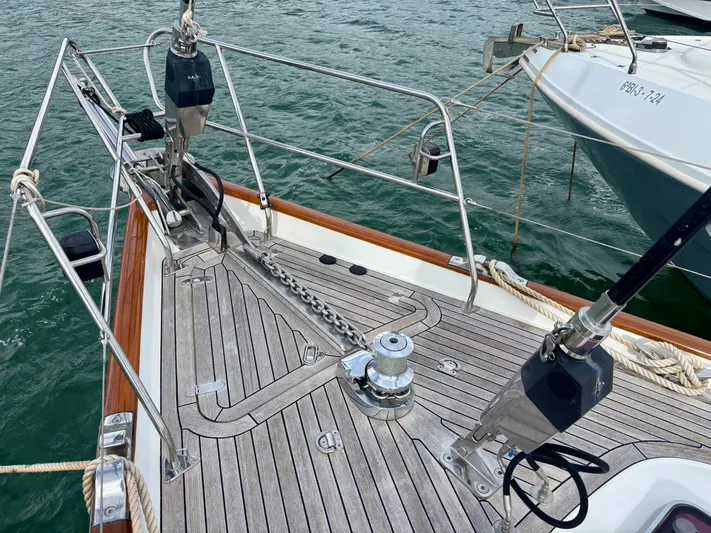  Yacht Photos Pics Bow of 2003 Oyster 56 yacht with teak deck and anchor chain.