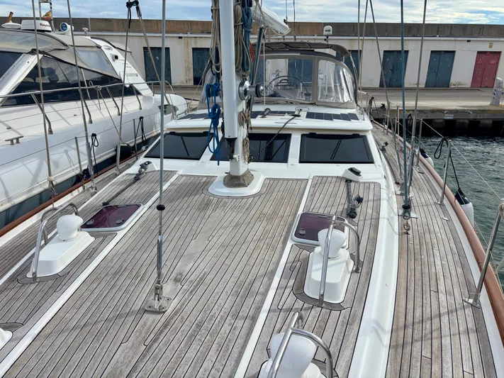  Yacht Photos Pics 2003 Oyster 56 sailboat with teak deck, docked at marina.