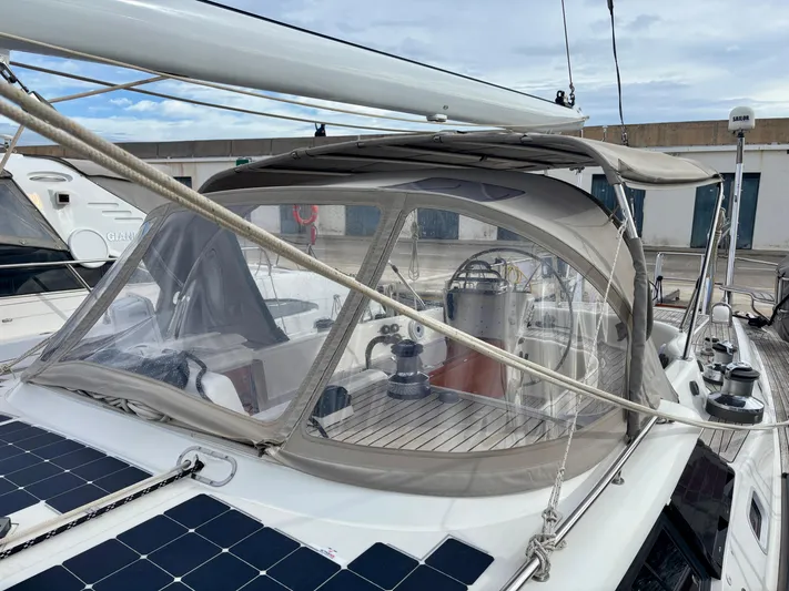  Yacht Photos Pics 2003 Oyster 56 yacht with solar panels and covered cockpit in marina.