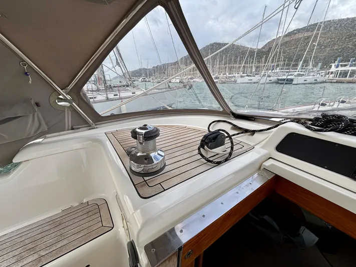  Yacht Photos Pics Cockpit view of 2003 Oyster 56 yacht with marina backdrop.