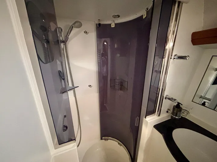  Yacht Photos Pics Bathroom interior of 2003 Oyster 56 yacht with modern shower and sink.