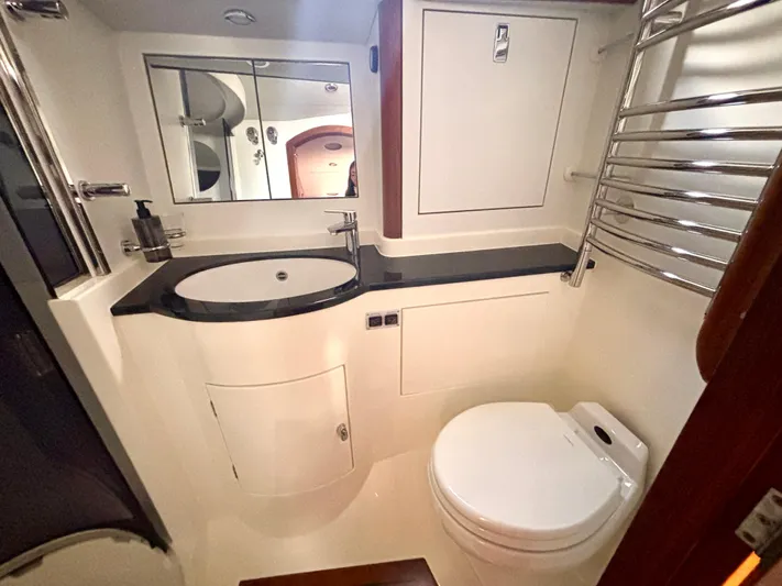  Yacht Photos Pics Luxurious bathroom in a 2003 Oyster 56 yacht, featuring modern fixtures and sleek design.