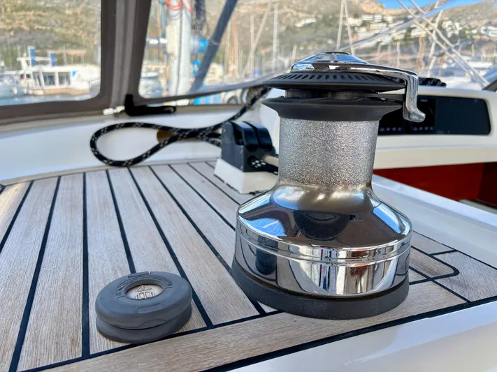  Yacht Photos Pics Sailing yacht winch on 2003 Oyster 56 deck, with marina view.