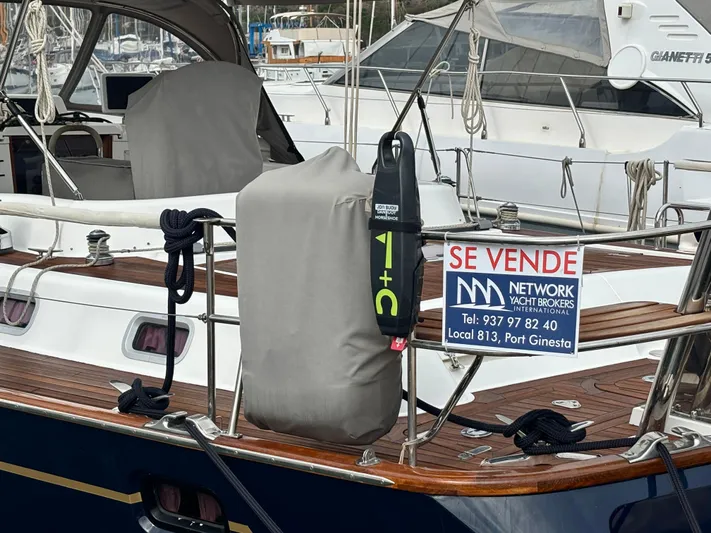  Yacht Photos Pics For sale sign on 2003 Oyster 56 yacht at marina.