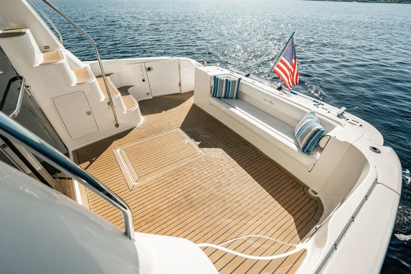 Love & Luck II Yacht Photos Pics Luxurious 2007 Sea Ray 580 Sedan Bridge yacht deck with seating and American flag.