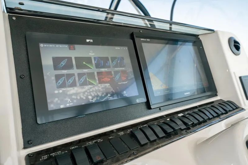 Love & Luck II Yacht Photos Pics Dashboard of 2007 Sea Ray 580 Sedan Bridge with navigation screens and controls.