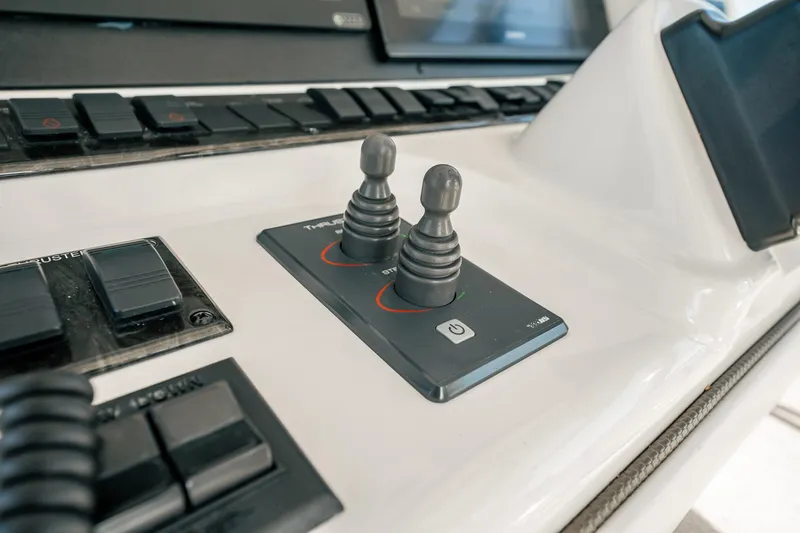 Love & Luck II Yacht Photos Pics Control panel of 2007 Sea Ray 580 Sedan Bridge with joysticks and buttons.