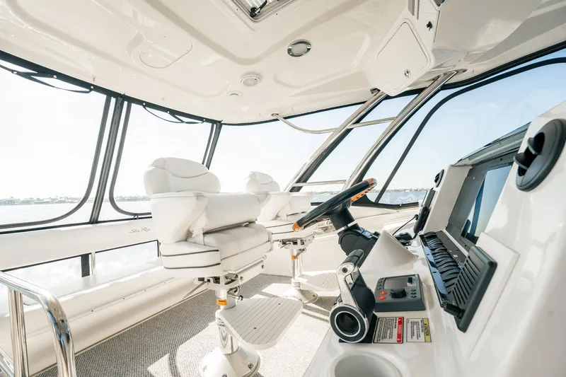 Love & Luck II Yacht Photos Pics Luxurious interior of 2007 Sea Ray 580 Sedan Bridge yacht with modern helm and seating.