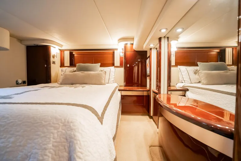 Love & Luck II Yacht Photos Pics Luxurious 2007 Sea Ray 580 Sedan Bridge yacht bedroom with elegant wood finishes.