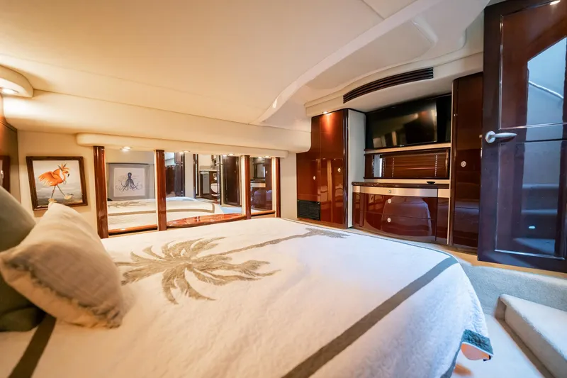 Love & Luck II Yacht Photos Pics Luxurious bedroom interior of 2007 Sea Ray 580 Sedan Bridge yacht with elegant decor.