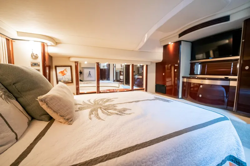 Love & Luck II Yacht Photos Pics Luxurious bedroom interior of 2007 Sea Ray 580 Sedan Bridge yacht with elegant decor.