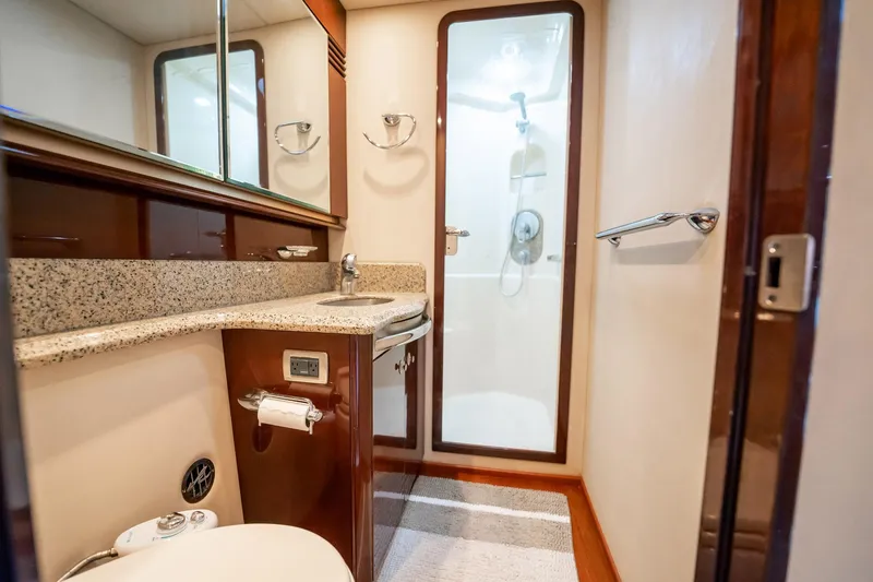 Love & Luck II Yacht Photos Pics Luxurious bathroom in 2007 Sea Ray 580 Sedan Bridge yacht with granite countertop and shower.