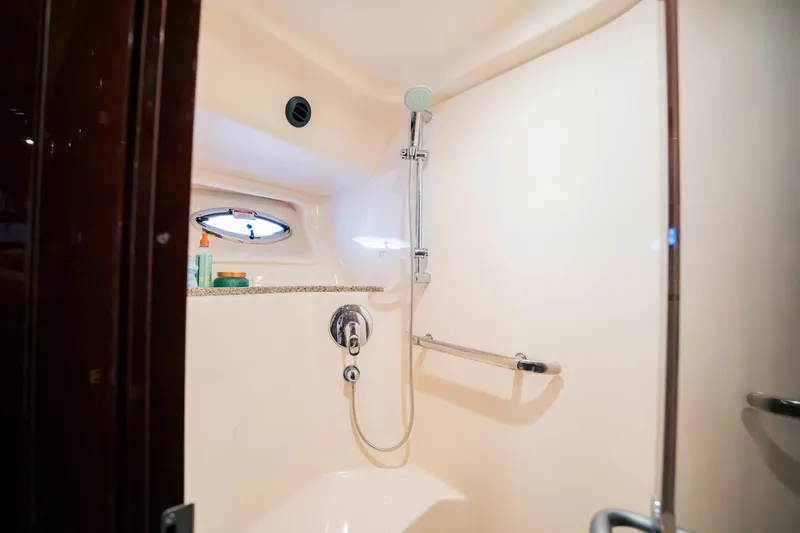 Love & Luck II Yacht Photos Pics Luxurious shower area in 2007 Sea Ray 580 Sedan Bridge yacht.