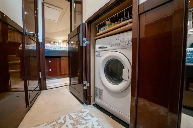 Love & Luck II Yacht Photos Pics 2007 Sea Ray 580 Sedan Bridge interior with built-in washing machine.