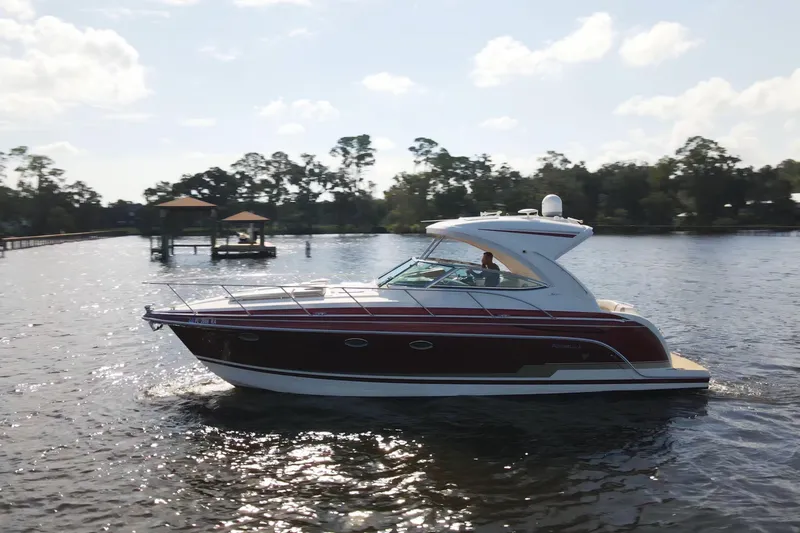 Let Me Liv! Yacht Photos Pics 2015 Formula 34 Performance Cruiser on a sunny lake, surrounded by trees.