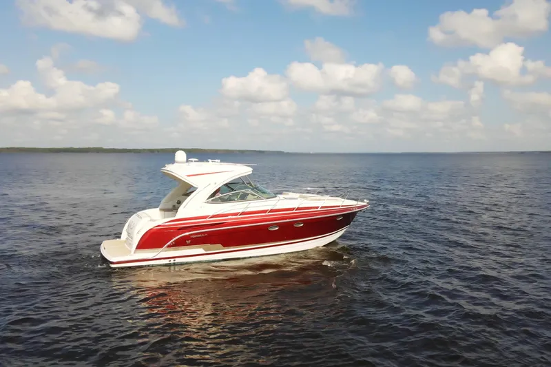 Let Me Liv! Yacht Photos Pics 2015 Formula 34 Performance Cruiser on open water under a partly cloudy sky.