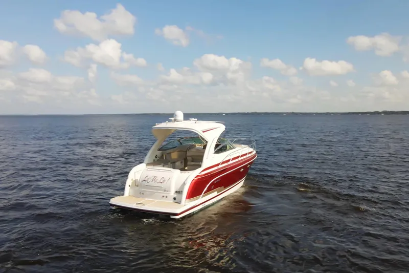 Let Me Liv! Yacht Photos Pics 2015 Formula 34 Performance Cruiser on open water under a blue sky.