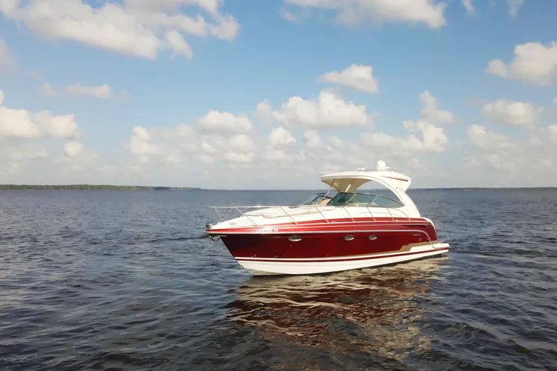 Let Me Liv! Yacht Photos Pics 2015 Formula 34 Performance Cruiser on open water under a partly cloudy sky.