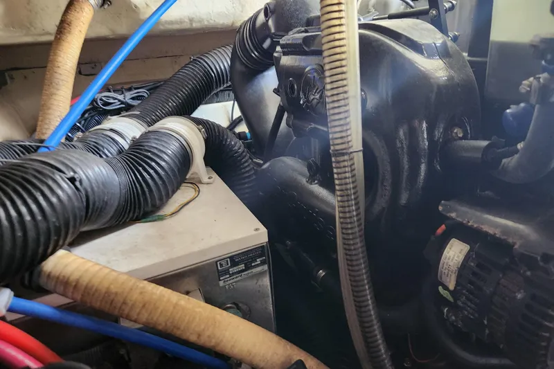 Let Me Liv! Yacht Photos Pics Engine compartment of a 2015 Formula 34 Performance Cruiser with visible hoses and components.