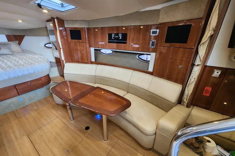 Let Me Liv! Yacht Photos Pics 2015 Formula 34 Performance Cruiser interior with wood accents and cozy seating area.