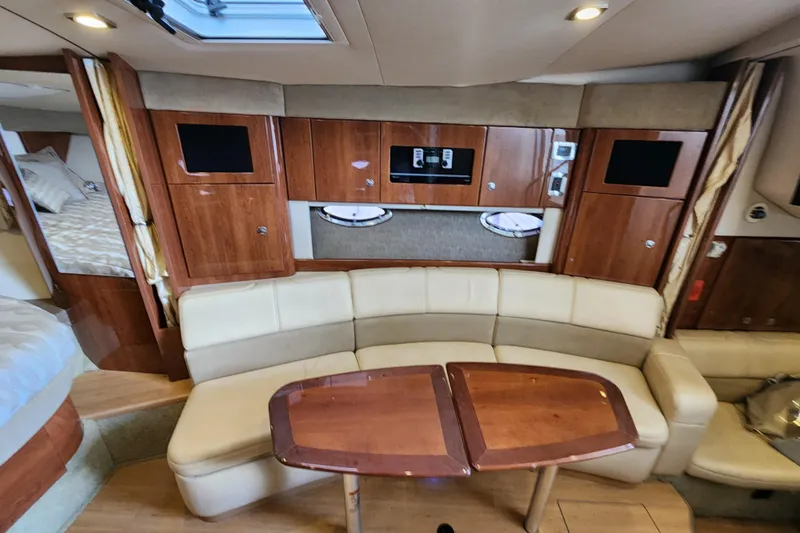 Let Me Liv! Yacht Photos Pics 2015 Formula 34 Performance Cruiser interior with wood cabinetry and cream seating.
