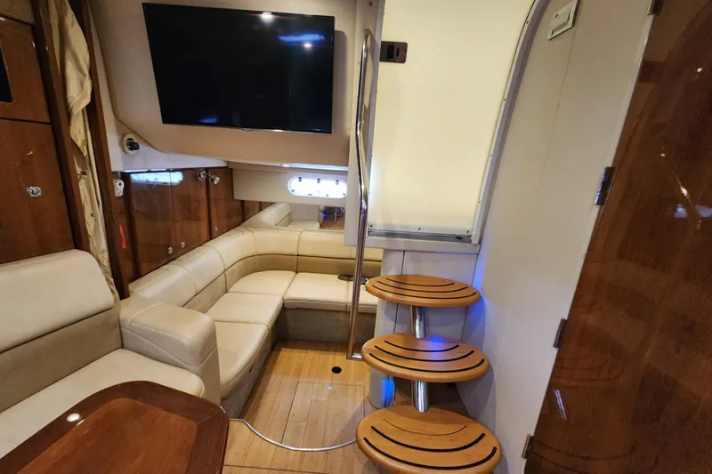 Let Me Liv! Yacht Photos Pics Interior of 2015 Formula 34 Performance Cruiser with leather seating and wooden steps.