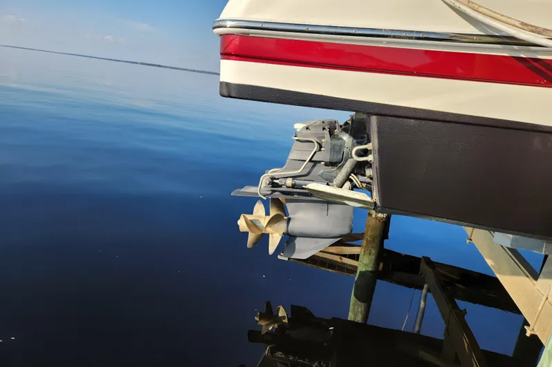 Let Me Liv! Yacht Photos Pics 2015 Formula 34 Performance Cruiser stern and propeller over calm water.