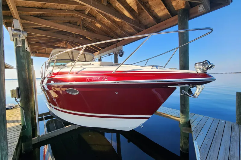 Let Me Liv! Yacht Photos Pics 2015 Formula 34 Performance Cruiser docked under wooden shelter.