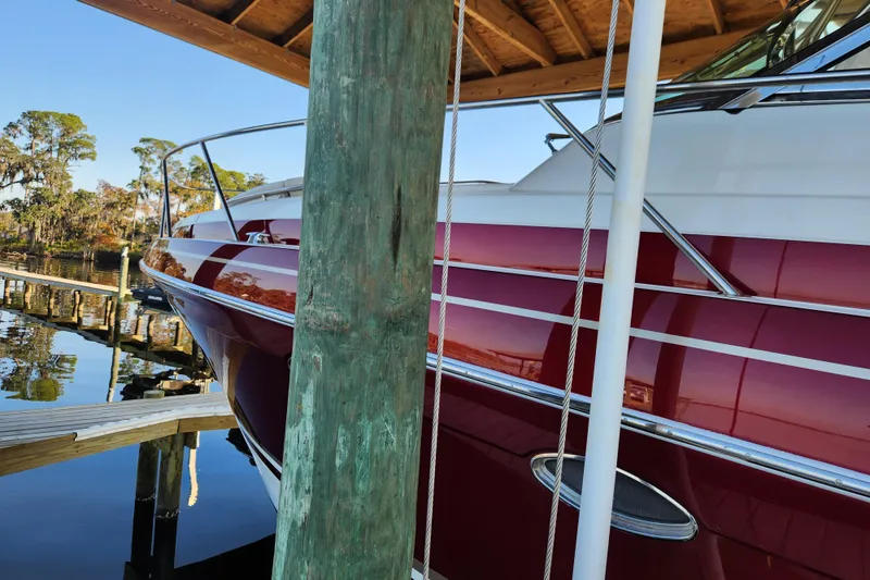 Let Me Liv! Yacht Photos Pics 2015 Formula 34 Performance Cruiser docked under wooden shelter.