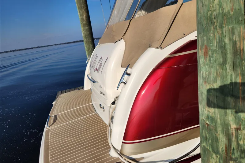 Let Me Liv! Yacht Photos Pics 2015 Formula 34 Performance Cruiser docked, featuring sleek red and white design.