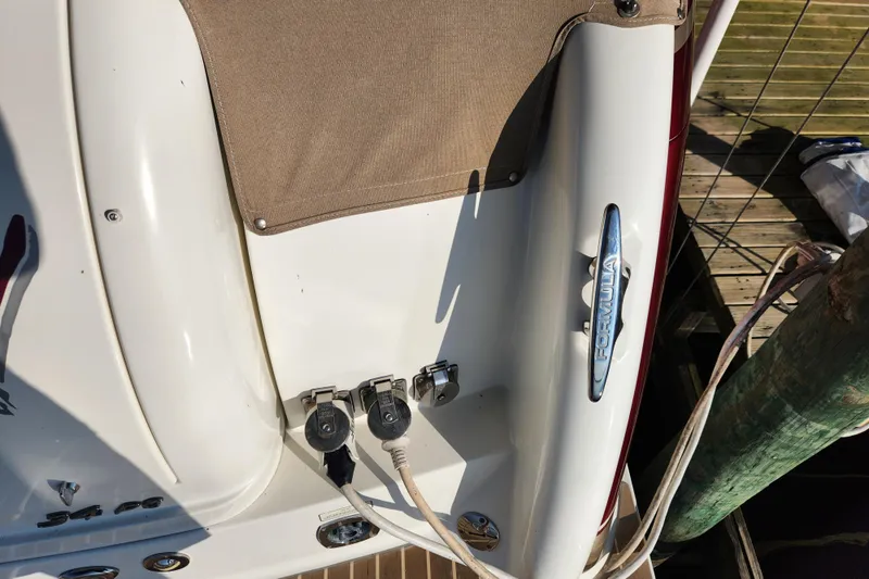 Let Me Liv! Yacht Photos Pics 2015 Formula 34 Performance Cruiser boat docked, showing power connections and branding.
