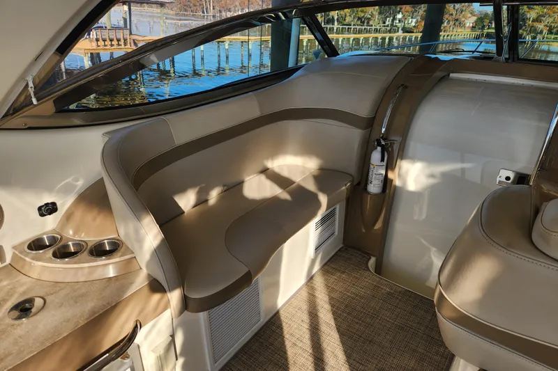 Let Me Liv! Yacht Photos Pics 2015 Formula 34 Performance Cruiser interior with beige seating and cup holders.