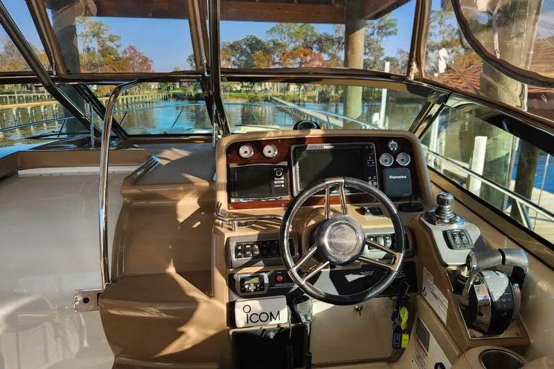 Let Me Liv! Yacht Photos Pics 2015 Formula 34 Performance Cruiser cockpit with steering wheel and navigation controls.