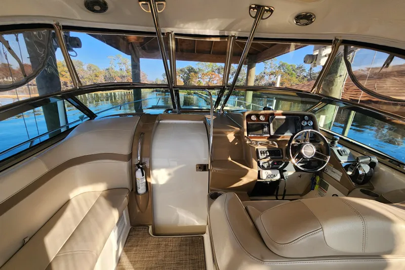 Let Me Liv! Yacht Photos Pics 2015 Formula 34 Performance Cruiser cockpit with modern controls and comfortable seating.