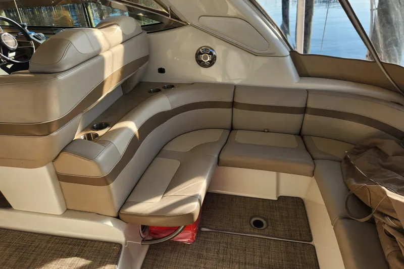 Let Me Liv! Yacht Photos Pics 2015 Formula 34 Performance Cruiser interior with beige seating and cup holders.