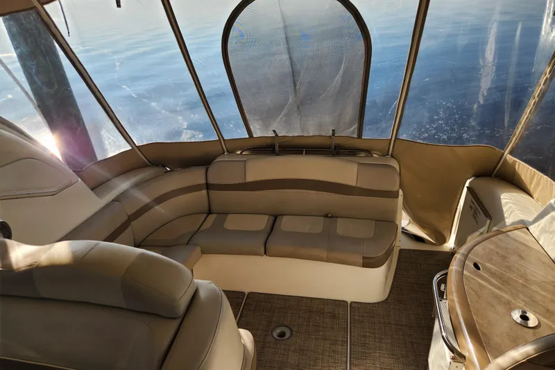 Let Me Liv! Yacht Photos Pics 2015 Formula 34 Performance Cruiser interior with beige seating and panoramic windows.