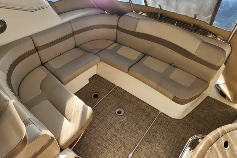 Let Me Liv! Yacht Photos Pics 2015 Formula 34 Performance Cruiser interior with beige seating and carpeted flooring.
