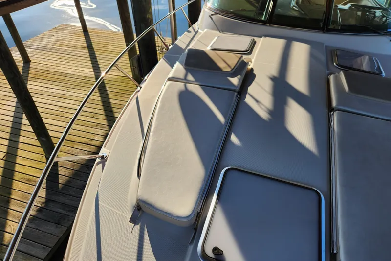 Let Me Liv! Yacht Photos Pics 2015 Formula 34 Performance Cruiser deck with sun pads and dock view.