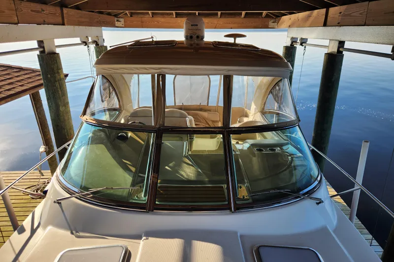 Let Me Liv! Yacht Photos Pics 2015 Formula 34 Performance Cruiser docked under a wooden shelter.