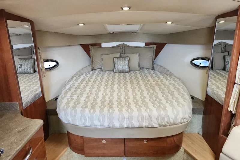 Let Me Liv! Yacht Photos Pics Luxurious cabin interior of 2015 Formula 34 Performance Cruiser with elegant bedding and wood accents.
