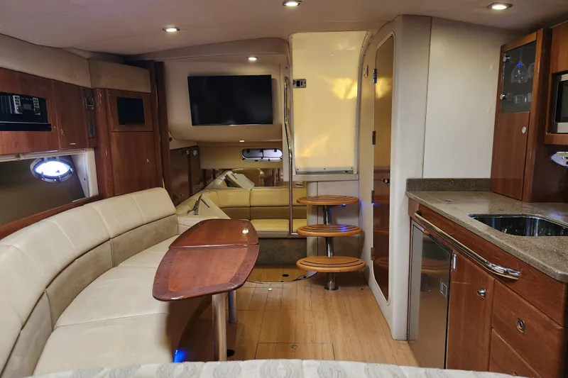 Let Me Liv! Yacht Photos Pics 2015 Formula 34 Performance Cruiser interior with modern kitchen, seating, and entertainment area.