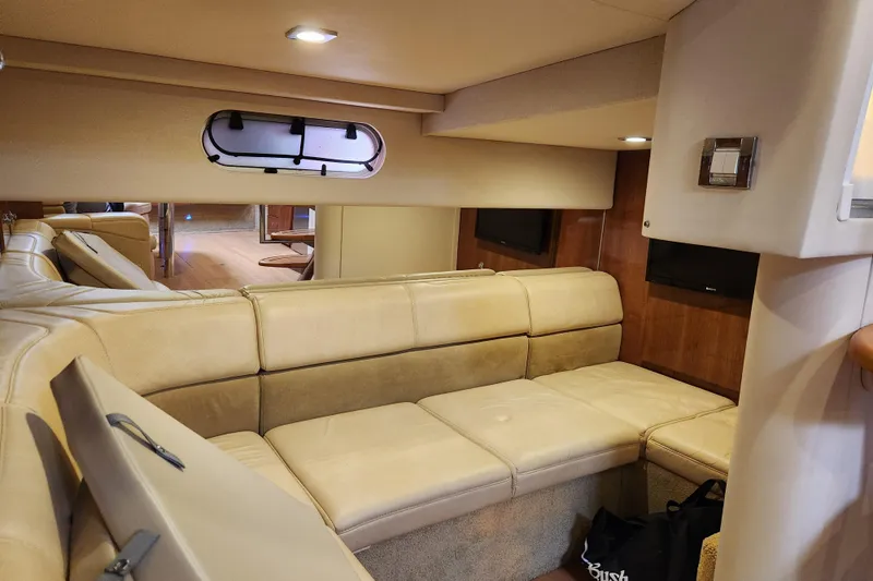 Let Me Liv! Yacht Photos Pics Interior of 2015 Formula 34 Performance Cruiser with beige leather seating and wood accents.