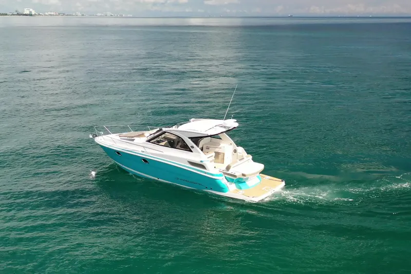  Yacht Photos Pics 2018 Regal 35 Sport Coupe cruising on open water.